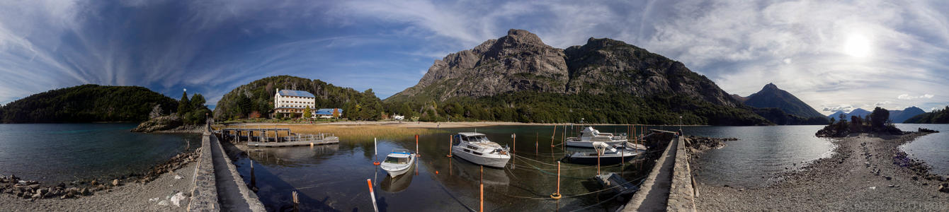 Camping Duirno Bahia Lopez 360 - A dock and a hotel situated in a beautiful calm cove on the main peninsula in Bariloche
