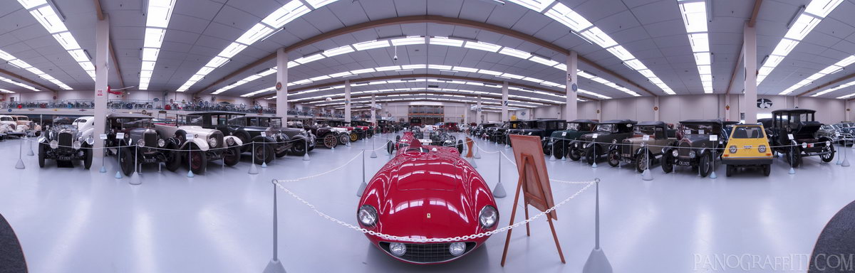 A Beautiful Old Ferrari - A beautiful old ferrari in the center of a room full of cars