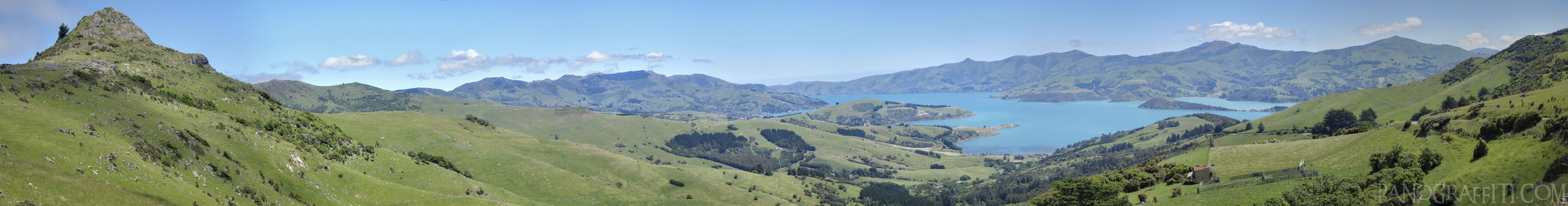 Akaroa Harbour from the Summit Road - Higher up on the Summer Road you can see more of Akaroa Harbour surrounded by the hills and peaks.